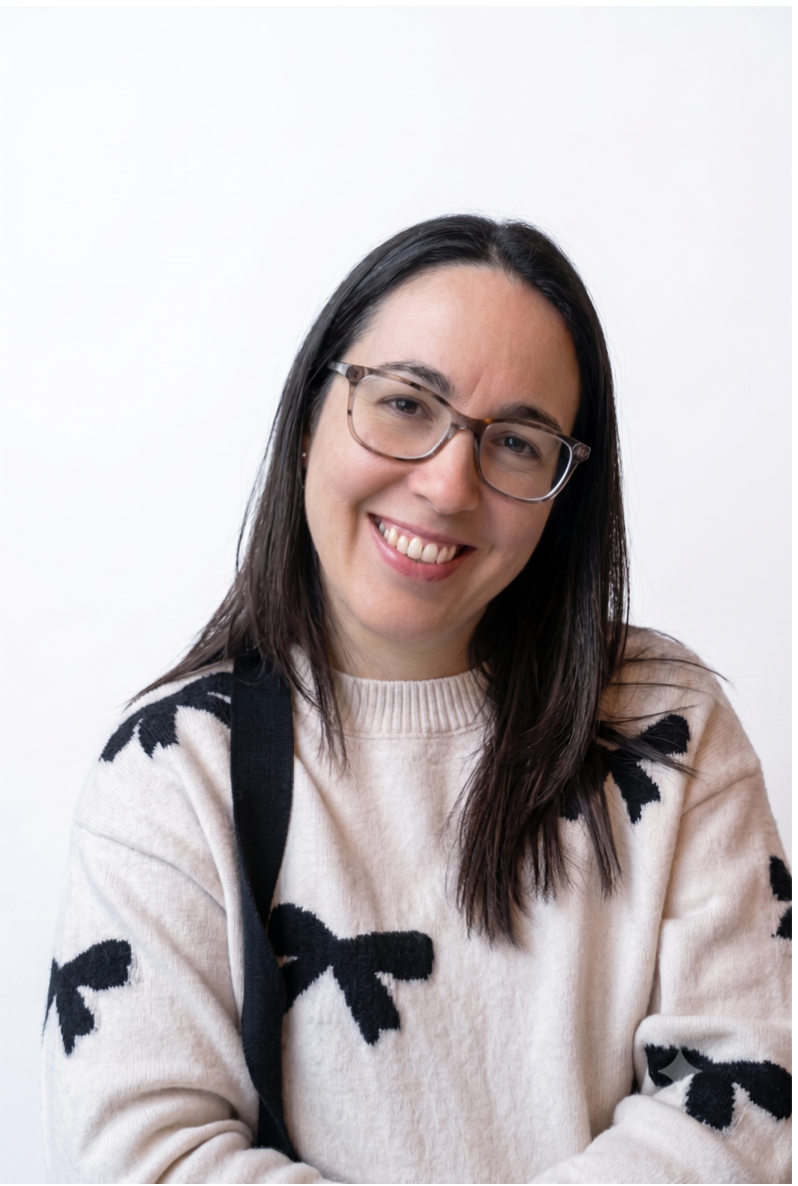 Tara Rogers, dramatherapist, smiling in a cream jumper